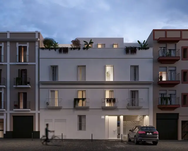 Infografía 3D de fachada a la calle al anochecer de Puntal de Dueñas, edificio residencial en Sevilla (Juan Luis Sánchez)
